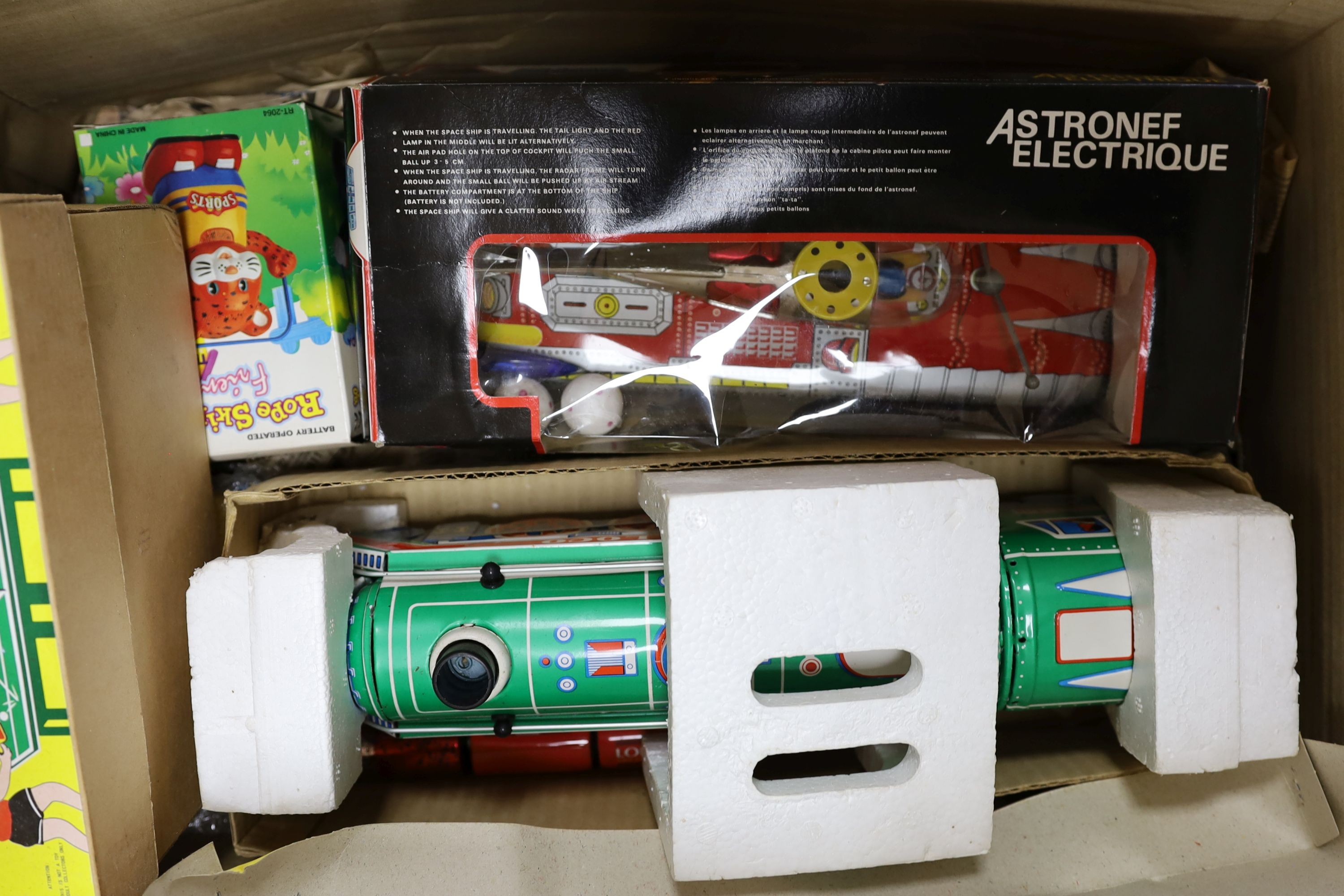 An assortment of boxed toys, including, Photoing Car car and Puff Puff loco
